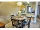 Dining area with four chairs and a view into the kitchen at 6801 Dali Ave # G104, Land O Lakes, FL 34637