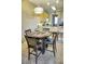 Dining area with four chairs and a view into the kitchen at 6801 Dali Ave # G104, Land O Lakes, FL 34637