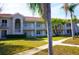 Exterior view of a two-story building with balconies and lush landscaping at 6801 Dali Ave # G104, Land O Lakes, FL 34637