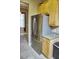 Kitchen features stainless steel refrigerator and wood cabinets at 6801 Dali Ave # G104, Land O Lakes, FL 34637