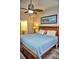 King-size bed, ceiling fan, ensuite bath access at 6801 Dali Ave # G104, Land O Lakes, FL 34637