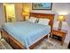 King-size bed, wood furniture, and ensuite access at 6801 Dali Ave # G104, Land O Lakes, FL 34637