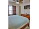 King-size bed, dresser, TV, and window at 6801 Dali Ave # G104, Land O Lakes, FL 34637