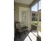 Screened-in porch with view of the backyard, perfect for relaxing at 6801 Dali Ave # G104, Land O Lakes, FL 34637