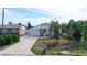 Single-story home with a driveway and landscaped yard at 7304 Sheepshead Dr, Hudson, FL 34667