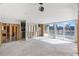 Large living area with pool view, ready for renovation at 7304 Sheepshead Dr, Hudson, FL 34667
