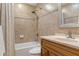 Updated bathroom with a walk-in shower and wood vanity at 7384 Prince George Ct, Spring Hill, FL 34606