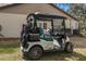 White EZGO golf cart with teal accents at 7384 Prince George Ct, Spring Hill, FL 34606