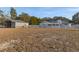 Metal barn and farmhouse in a fenced-in yard at 9331 Elida Rd, Spring Hill, FL 34608