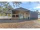 Open barn with a feeding trough and gated area at 9331 Elida Rd, Spring Hill, FL 34608