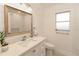 Modern bathroom with white shiplap walls and quartz countertop at 9331 Elida Rd, Spring Hill, FL 34608