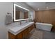 Modern bathroom with double vanity and soaking tub at 9331 Elida Rd, Spring Hill, FL 34608
