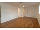 Spacious bedroom with hardwood floors and access to bathroom at 9331 Elida Rd, Spring Hill, FL 34608