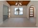 Bright dining room with wood ceiling and large window at 9331 Elida Rd, Spring Hill, FL 34608