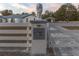Property entrance with custom gate and address plaque at 9331 Elida Rd, Spring Hill, FL 34608