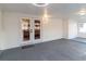 Covered patio with grey flooring and access to backyard at 9331 Elida Rd, Spring Hill, FL 34608