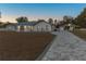 Single story home with metal roof and paver driveway at 9331 Elida Rd, Spring Hill, FL 34608