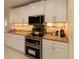 Modern kitchen with stainless steel appliances and white cabinets at 9331 Elida Rd, Spring Hill, FL 34608