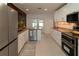 Updated kitchen with stainless steel appliances and granite counters at 9331 Elida Rd, Spring Hill, FL 34608
