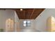 Bright and airy living room with hardwood floors and arched entryways at 9331 Elida Rd, Spring Hill, FL 34608