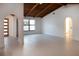 Bright and airy living room with hardwood floors and arched entryways at 9331 Elida Rd, Spring Hill, FL 34608