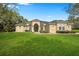 Beautiful home exterior with manicured lawn at 10331 Fox Sparrow Ave, Weeki Wachee, FL 34613