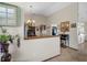 Welcoming entryway featuring wood trim, light colored walls, tiled floors, and decor on the walls and tables at 10473 Claymore St, Spring Hill, FL 34608