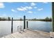 Wooden dock with water access and ladder at 1137 Marina Dr, Tarpon Springs, FL 34689