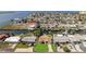Aerial of the waterfront neighborhood showcasing canal access, nearby amenities, and coastal charm at 13531 Allyn Dr, Hudson, FL 34667