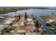 Aerial of the waterfront neighborhood showcasing canal access, nearby amenities, and coastal charm at 13531 Allyn Dr, Hudson, FL 34667