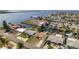Aerial of the waterfront neighborhood showcasing canal access, nearby amenities, and coastal charm at 13531 Allyn Dr, Hudson, FL 34667
