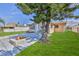 Relaxing backyard featuring a patio, fire pit, and mature tree that offers natural shade at 13531 Allyn Dr, Hudson, FL 34667