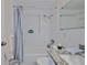 Bright bathroom with a tub shower and granite vanity at 13531 Allyn Dr, Hudson, FL 34667