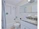 Bathroom featuring a tub with shower, and a granite vanity at 13531 Allyn Dr, Hudson, FL 34667