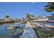 Waterfront home featuring a private dock and canal access, perfect for boating enthusiasts at 13531 Allyn Dr, Hudson, FL 34667