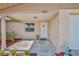 Covered front porch with decorative plants, turtle door decor, and view to the front yard at 13531 Allyn Dr, Hudson, FL 34667