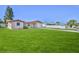 Charming single-story home with a well-manicured lawn and driveway leading to an attached garage at 13531 Allyn Dr, Hudson, FL 34667