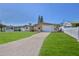 Lovely one-story home features green grass, a driveway to the garage, and neighborly white fences at 13531 Allyn Dr, Hudson, FL 34667