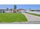 Inviting one-story home boasts a lush lawn and a convenient driveway to the attached garage at 13531 Allyn Dr, Hudson, FL 34667
