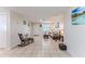 Living room features tile flooring, neutral walls, and a view to the front yard at 13531 Allyn Dr, Hudson, FL 34667