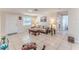 Inviting living room with tile flooring, ample natural light, and neutral decor at 13531 Allyn Dr, Hudson, FL 34667