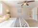 Bedroom featuring wood-look flooring, a ceiling fan, and ensuite access at 13531 Allyn Dr, Hudson, FL 34667