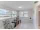 Bright sitting area with decor, views of the canal, and tile floors at 13531 Allyn Dr, Hudson, FL 34667