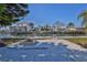 Backyard fire pit and fenced yard overlooking a canal with docks and waterfront homes at 13531 Allyn Dr, Hudson, FL 34667