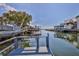 Scenic waterfront view showing a tranquil canal, boat docks and waterfront living at 13531 Allyn Dr, Hudson, FL 34667