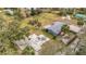 The aerial view captures the home's location, highlighting the backyard and adjacent shed at 14034 Water Tower Dr, Hudson, FL 34667