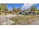 A backyard featuring a fire pit and ample space for outdoor enjoyment and entertainment at 14034 Water Tower Dr, Hudson, FL 34667