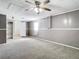 This bedroom features neutral carpet and paint, a ceiling fan, and an attached closet at 14034 Water Tower Dr, Hudson, FL 34667
