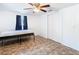 Bedroom with wood floors, sliding closet doors, and a ceiling fan at 14034 Water Tower Dr, Hudson, FL 34667