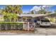 Charming single-story home with a well-manicured yard and a covered carport at 14034 Water Tower Dr, Hudson, FL 34667